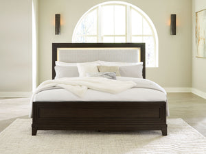  this queen upholstered panel bed completes your sanctuary with fashionable functionality. LED backlighting steals the show