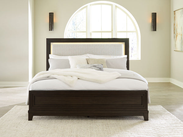  this queen upholstered panel bed completes your sanctuary with fashionable functionality. LED backlighting steals the show