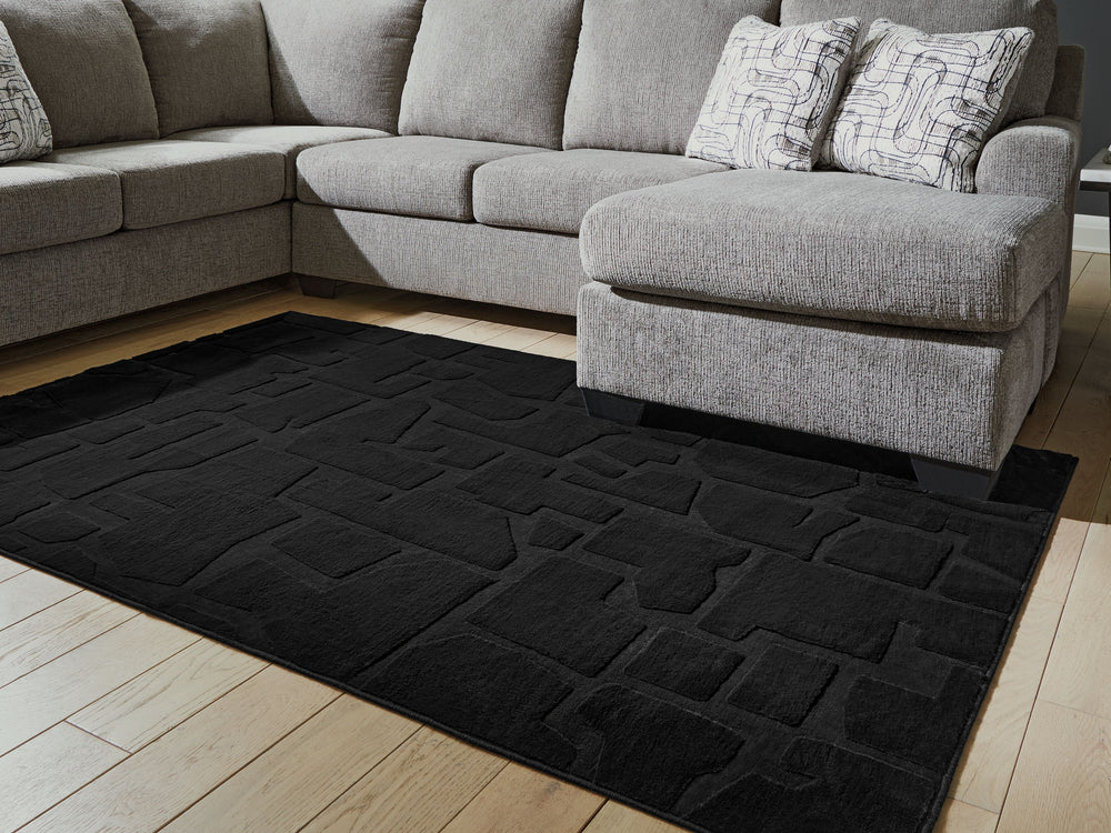 Everyone loves a fun, furry floor covering. The subtly stunning abstract design of the Gibbswell faux fur rug adds a trendy look thatâ€™s sure to elevate any modern home. And the textured rug is super easy to cleanâ€”simply drop it in the washing machine.