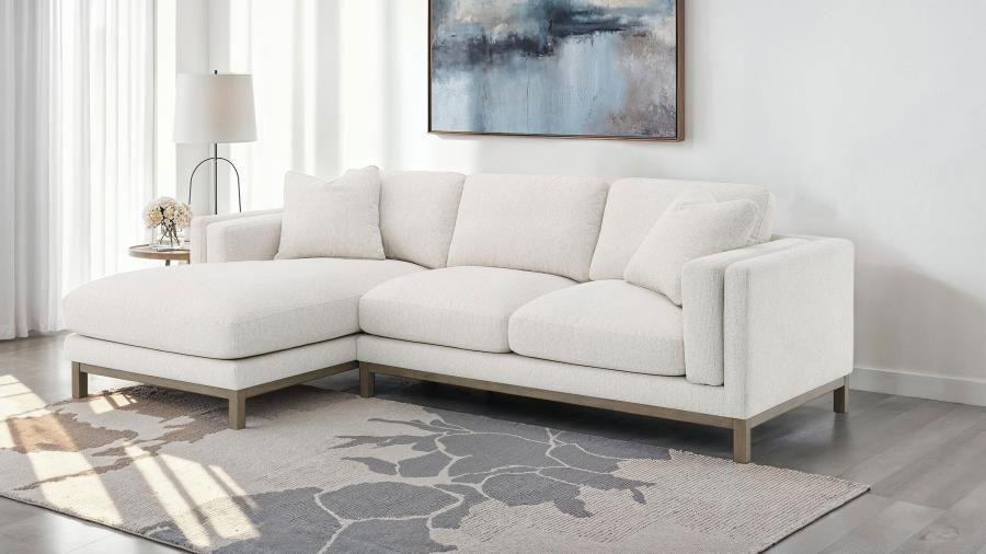 Indulge in the inviting comfort of this modern sectional sofa, thoughtfully designed with a left side chaise to accommodate your personal lounging preferences. Upholstered in a soft, textured bouclÃ© fabric, complemented with a solid wood pedestal base in