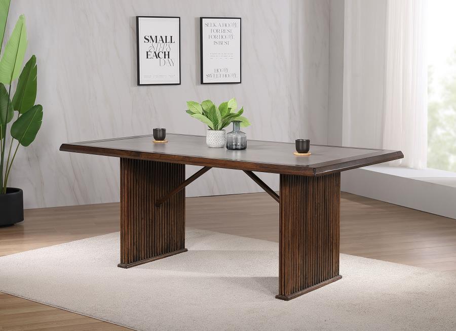 Enhance your dining space with this elegant 72-inch dining table. The reeded base adds texture and sophistication, combining beautifully with its robust construction from Asian hardwood and engineered wood. A sleek ceramic top provides a smooth, durable s