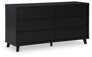 Sophisticated style for the savvy shopper. This dresser prioritizes affordable, on-trend design. Its subtle replicated texture recalls the natural beauty of wood, highlighting the slatted styling. And a matte black finish savvily suits different approache