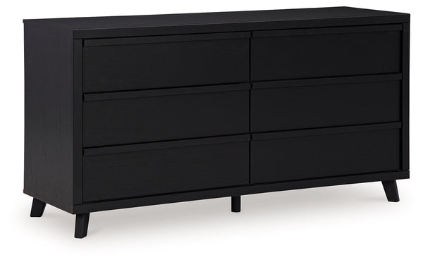 Sophisticated style for the savvy shopper. This dresser prioritizes affordable, on-trend design. Its subtle replicated texture recalls the natural beauty of wood, highlighting the slatted styling. And a matte black finish savvily suits different approache