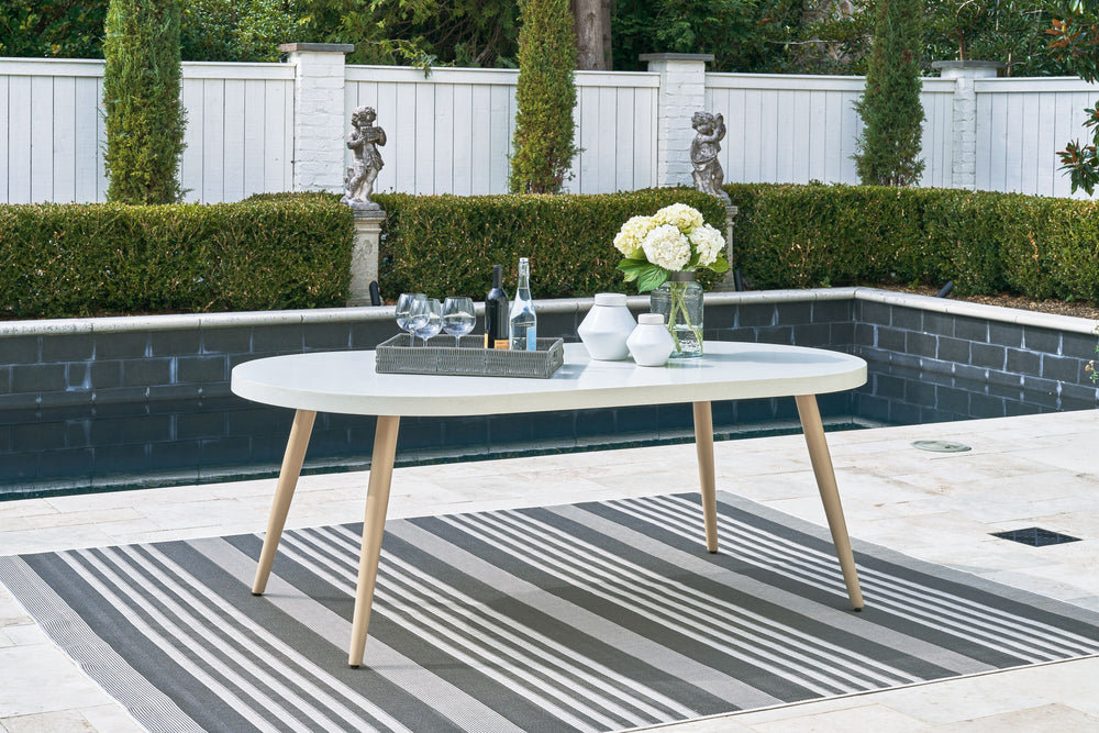 This dining table invites your casual contemporary style outdoors. With an elegant faux stone top, it expertly marries refined design with durability. At this table, breezy summer mornings and cold winter nights are made all the more enjoyable.<br><br><b>