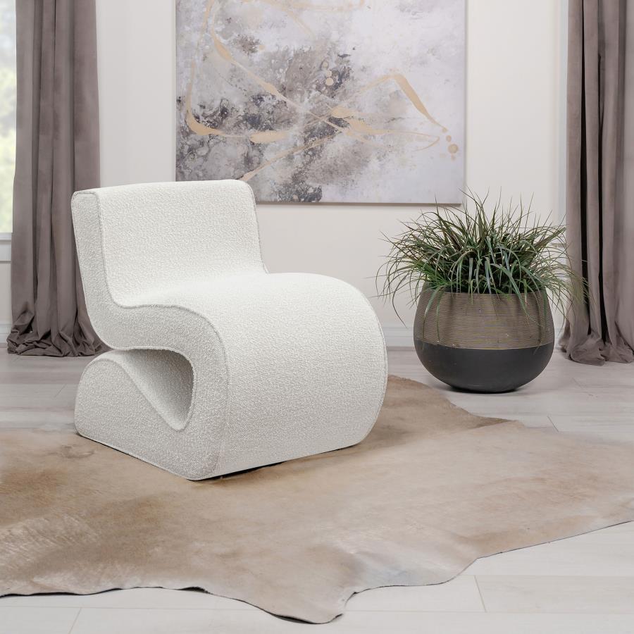 Step into the vanguard of home dÃ©cor with this modern accent chair, its bouclÃ© fabric not just on-trend but a textural revelation. The chair-'s unique shape is a conversation starter, sculpted to cradle and command attention in any setting. It-'s an emb