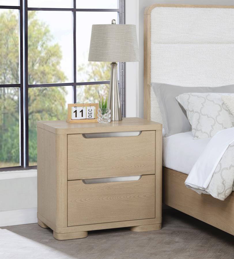 Blending sleek design with practical functionality, this nightstand features a light elm finish and brushed nickel fingertip pulls for a subtle sparkle. Rounded corners enhance its modern appeal, while two extra-large drawers offer ample space for bedside
