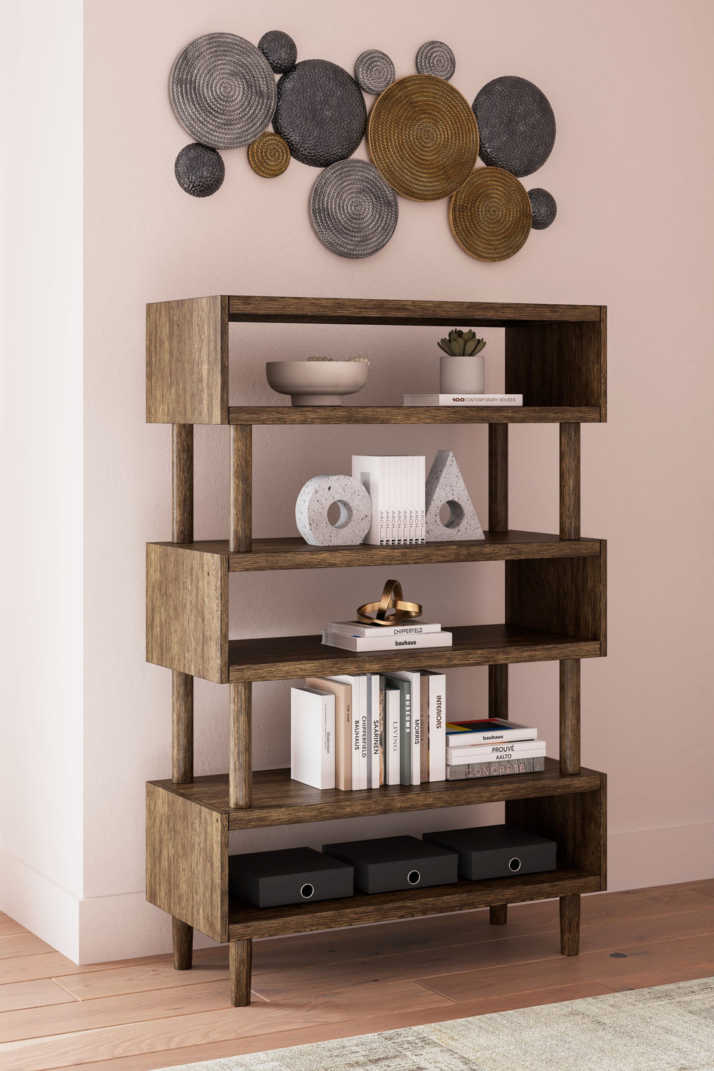 This bookcase expertly blends modern form and function. Its warm brown finish acts as a beautiful backdrop to your books and decorative displays. With a geometric, retro-inspired design lending a subtly eclectic character, itâ€™s a stylish home office sta