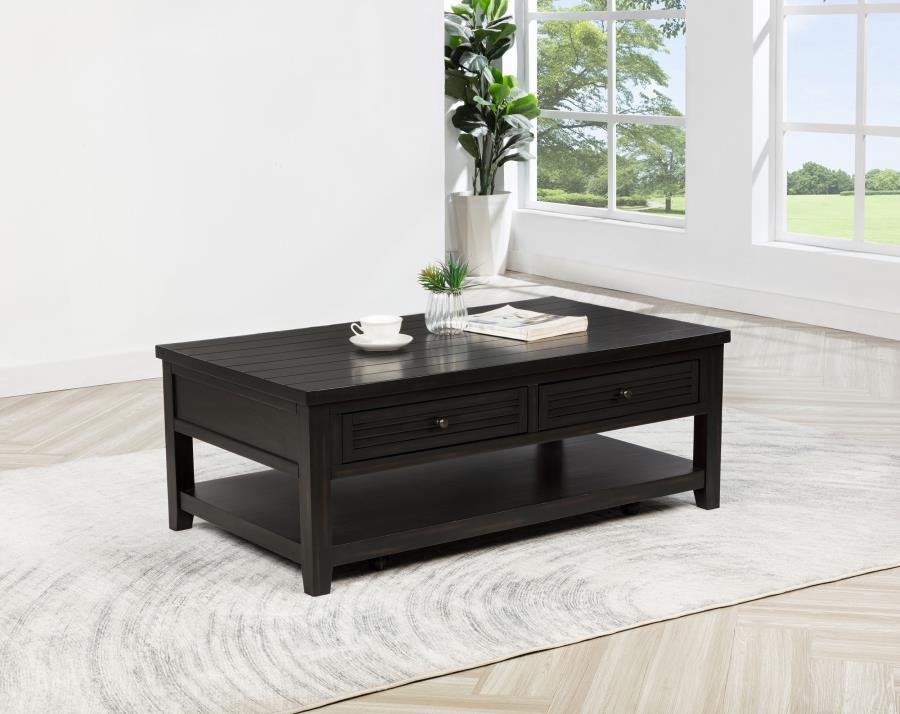 Bring a touch of timeless charm to your living room with this versatile coffee table. Featuring solid wood legs and a beautiful engineered wood frame with a distressed java finish over pine veneer, it offers both durability and style. The planked wood top