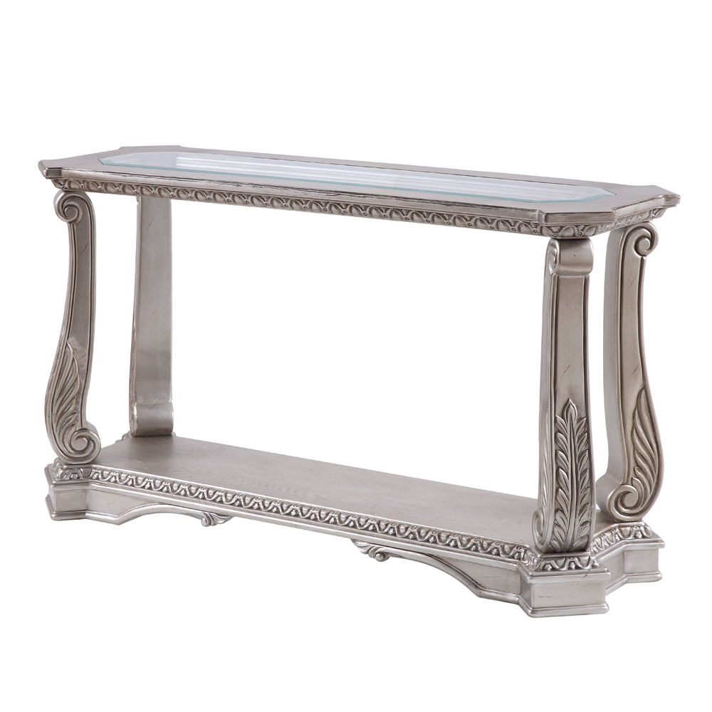Entertain in style with the Northville Sofa Table. This classic rectangular occasional table features an Antique Silver and a tempered glass top. This distinctive cocktail is accented with wooden floral scrolled legs and a beveled glass insert and an open