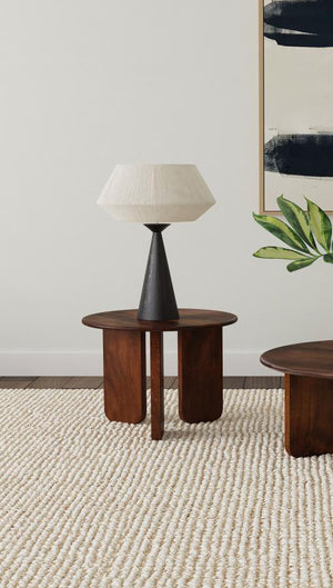 it features a deep brown finish that highlights the natural wood grain for added character. The round tabletop provides a stylis