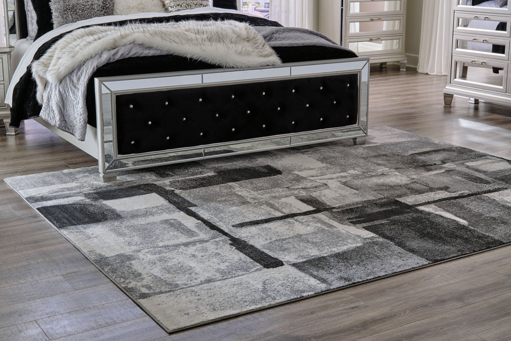 This area rug features a striking abstract design in black, gray and cream. Its ethereal look dresses up a room with subtle color, visual texture and a highly contemporary point of view.<br/><br/><b>Product Features</b><ul><li>Made of polypropylene</li><l