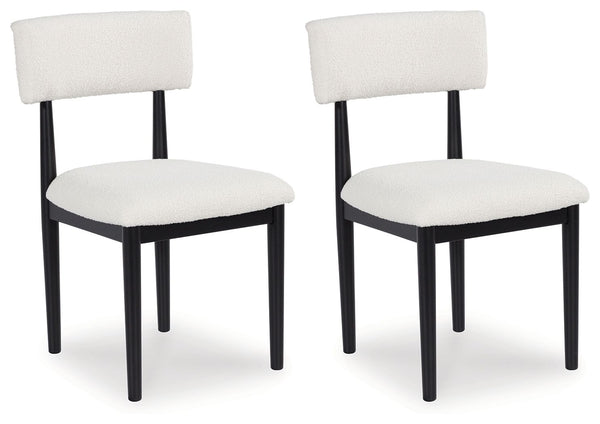 Clean lines meet cool curves with this dining chair. Simple round post legs and a black finish lend a modern vibe, while softly textured upholstery tempts you to sit and stay awhile. What a delicious choice for a dining room update.<br><br><b>Additional D