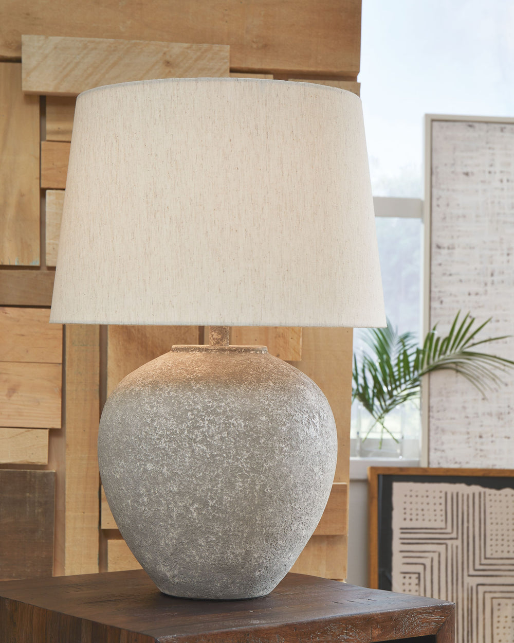 Mimic the raw beauty of stone with this table lamp. Its minimal ornamentation suits spaces that prioritize functionality over detailed decor, incorporating natural beauty and light wherever you need it most.<br><br><b>Additional Dimensions</b><br><ul><li>