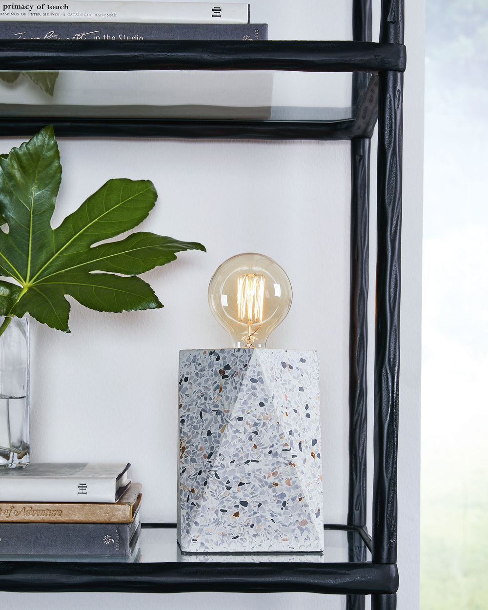 Inspired by trend-right stone sculptures, this table lamp offers a practical way to bring contemporary style to your home. Playful speckles in natural tones add an intriguing element to any desk, nightstand or end table.<br><br><b>Additional Dimensions</b