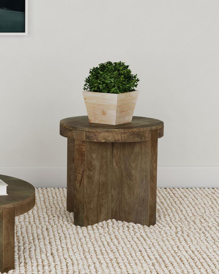 Thick slabs of beautiful mango wood create a compelling silhouette for a modern wooden end table. Its round top creates a cohesive feel, while thick legs add substance. A deep brown finish complements the wood to perfection, offering a sense of sophistica