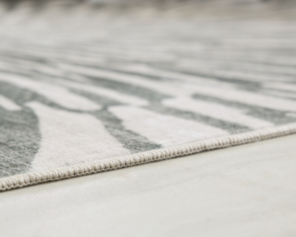 This rug takes traditional design motifs and brings them into the present. Outfitted with deliciously soft faux fur and a chic sunburst design in shades of gray and white, it-'s an apt addition to contemporary interiors. Further suiting your modern lifest