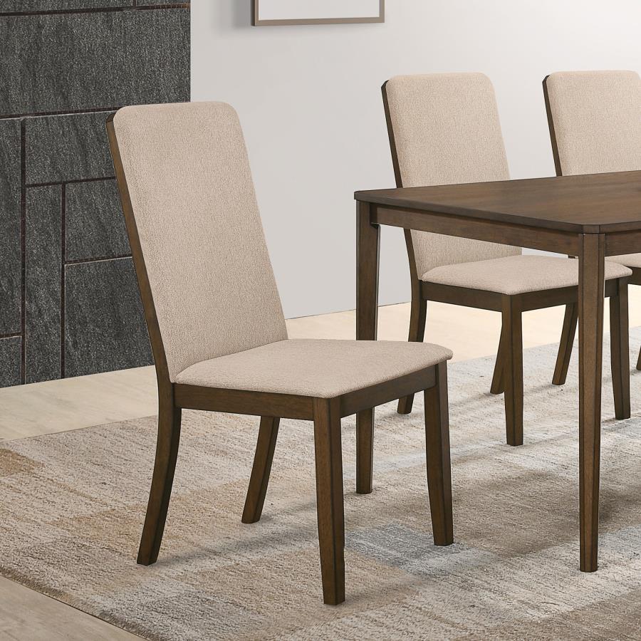 Treat your family to a comfortable dining experience. This beautiful, upholstered dining chair is crafted for comfort with a tall, supportive seat back and plush, cozy cushioning. Soft, rich, latte twill fabric gives it a light, airy look. The sturdy, woo