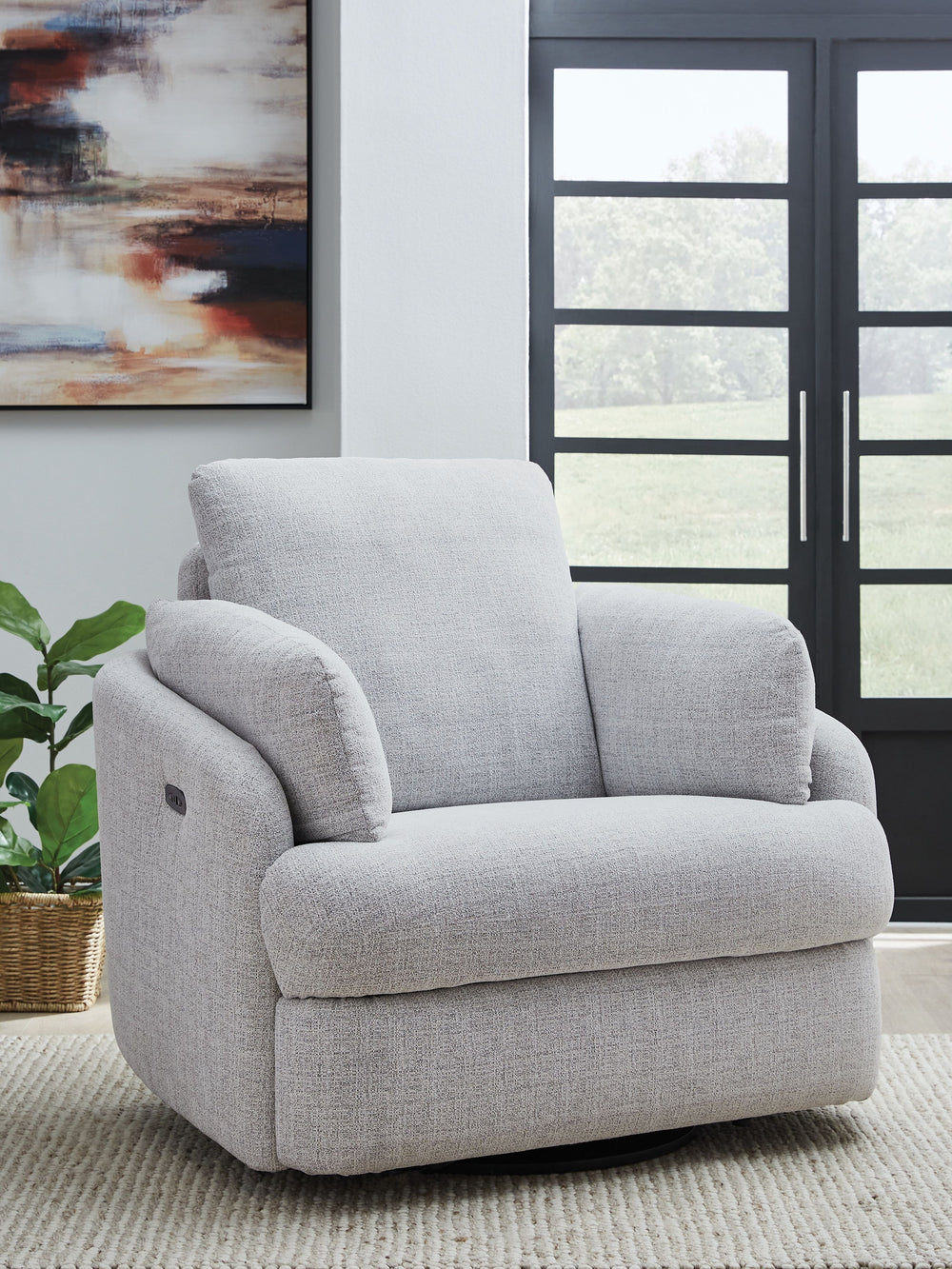 Indulge in ultimate comfort and style with this Next-Gen Nuvellaâ„¢ swivel power recliner. The contemporary chair allows you to effortlessly find the perfect position for relaxation, whether you-'re enjoying a movie night or simply unwinding after a long 