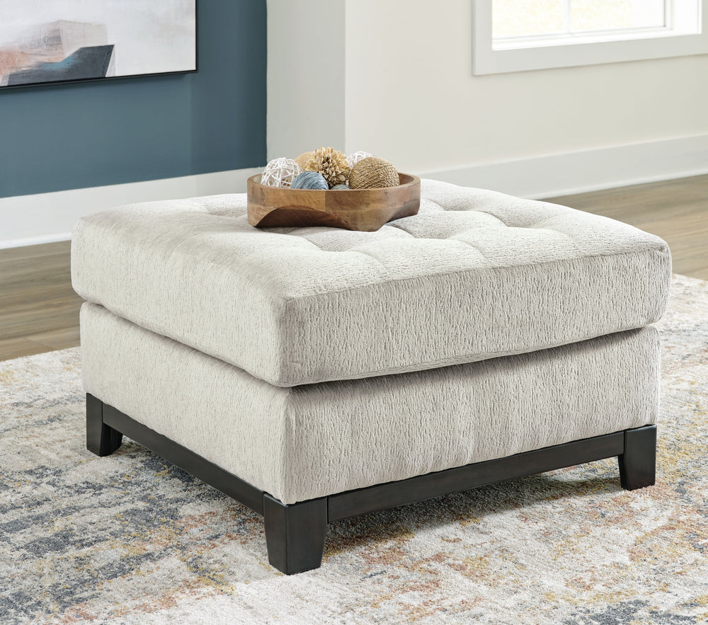 Fresh, on-trend style meets functionality in this oversized accent ottoman. Details like a tufted top cushion and wrap-around accent base reflect your urban contemporary tastes while staying versatile as your style changes. And with its soft upholstery, y