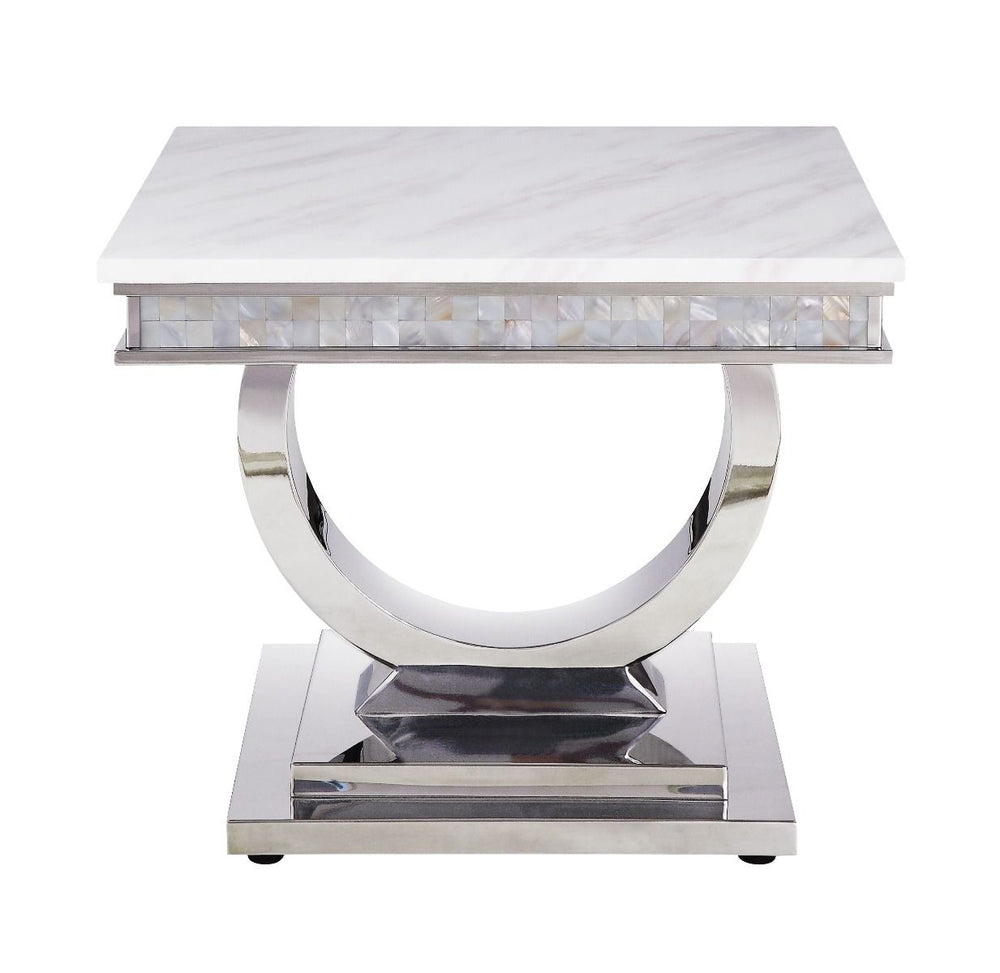 This beautiful contemporary work places a strong emphasis on lustrous materials that make a bold statement of personality and style. Shiny metal frame and white marble top complement each other perfectly, making the table more visually appealing. The Zand