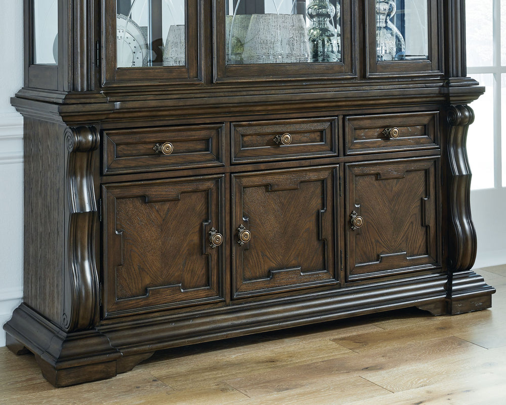 From its ornamental appliques to its large scale, this dining buffet makes a bold statement. With multiple cabinets and drawers to store necessities, the opulent piece wows with stunning style. The look is timeless. The feel? Right at home.<br><br><b>Addi