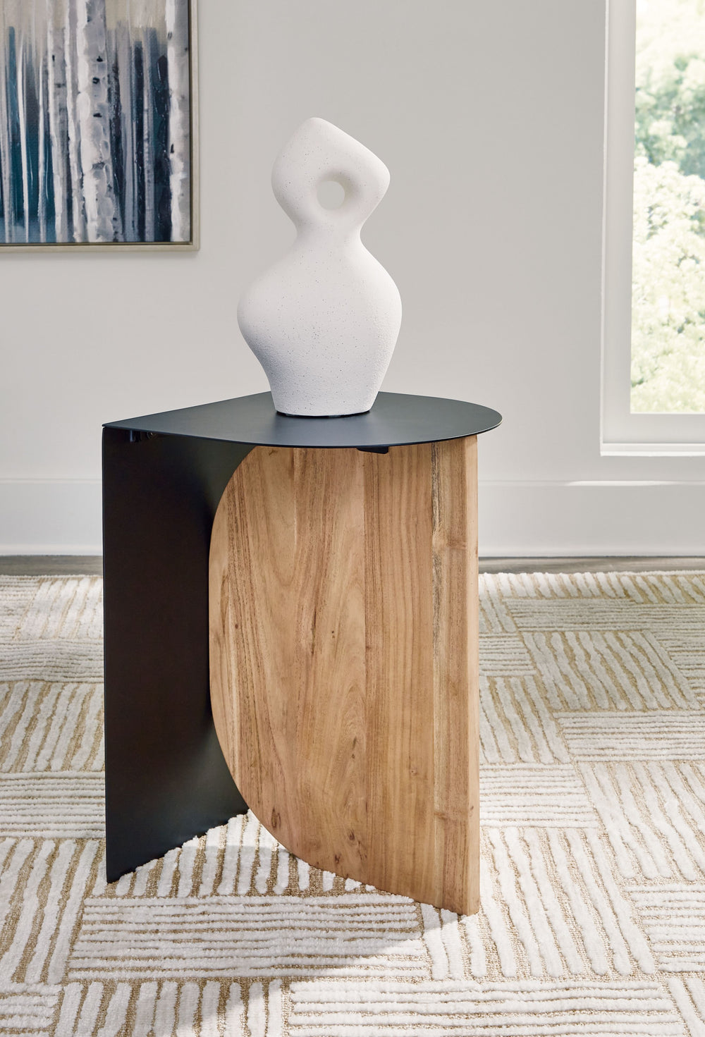 Marvel at the mixed-material beauty of this accent table. Its unique approach to the classic combination of metal and wood provides your space with visual variety, balancing contemporary styling with an almost industrial vibe. Its fuss-free design offers 