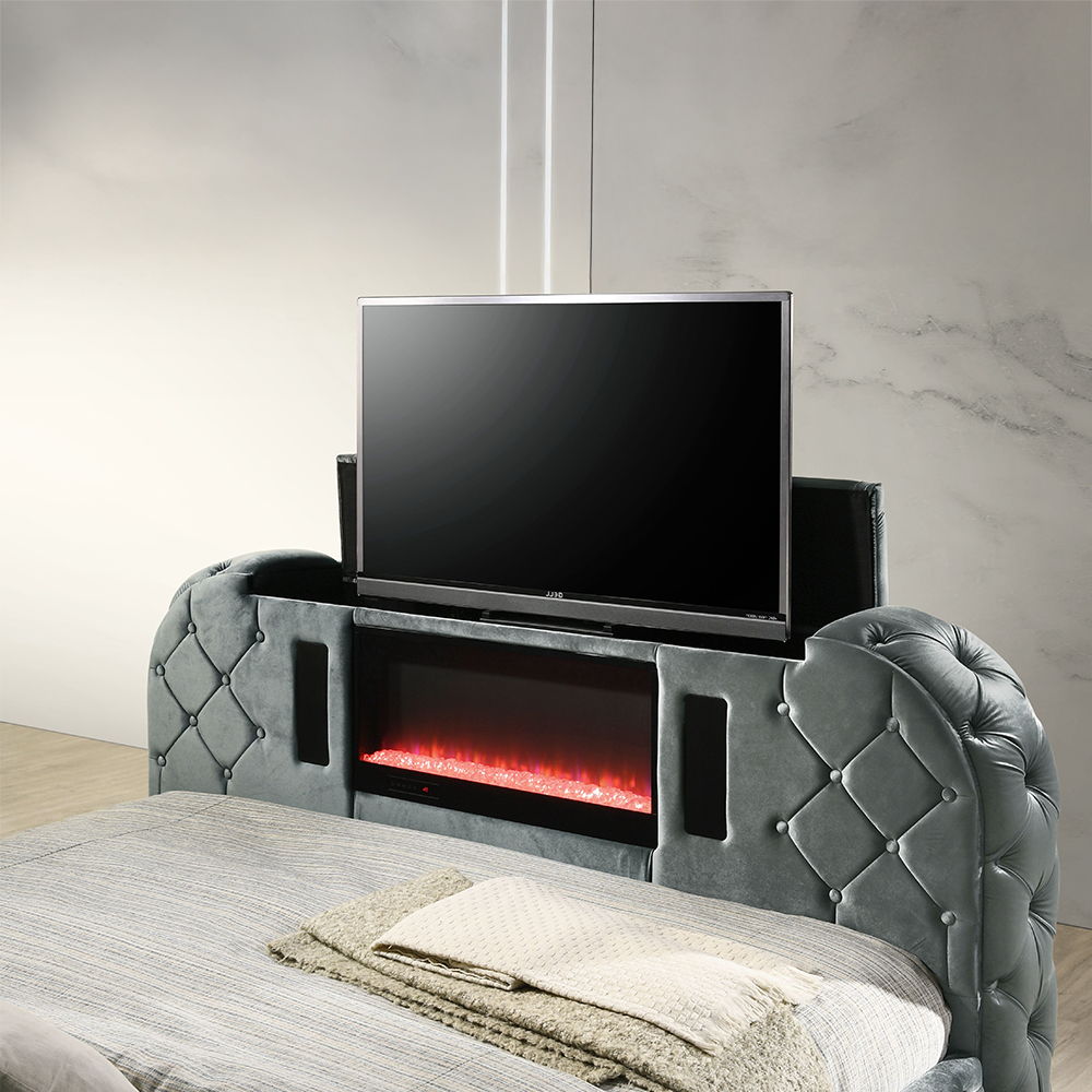 Cozy up in bed with the Kana Gray velvet bed. This bed features all the bells and whistles imaginable that make it impossible to ever leave. The built-in footboard fireplace (without heat) creates a relaxing ambiance. The footboard also houses a hidden TV