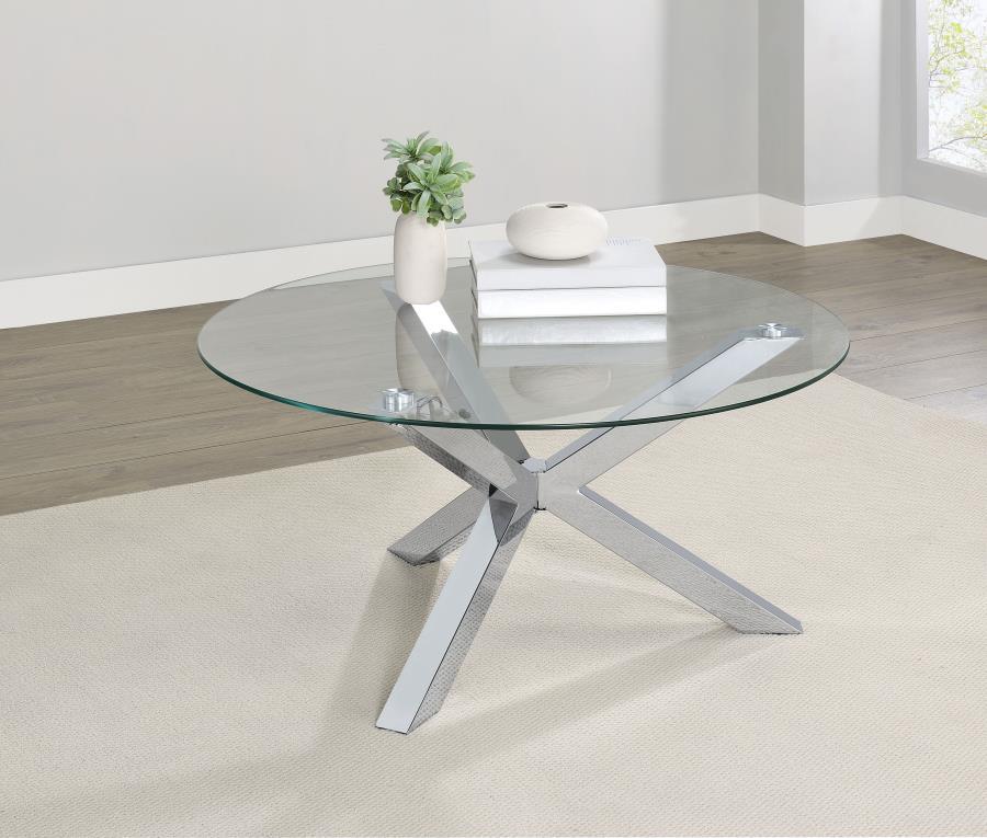 This modern center table fuses simplicity and sophistication, showcasing a tempered glass surface atop a striking, heavy gauge steel base with electroplated chrome and a polished finish. As a versatile cocktail table, accent table, or low table, it elevat