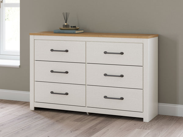  while framed drawer fronts with pewter-tone handles enhance its charming appeal. Looking for furniture that offers storage and a peaceful escape 