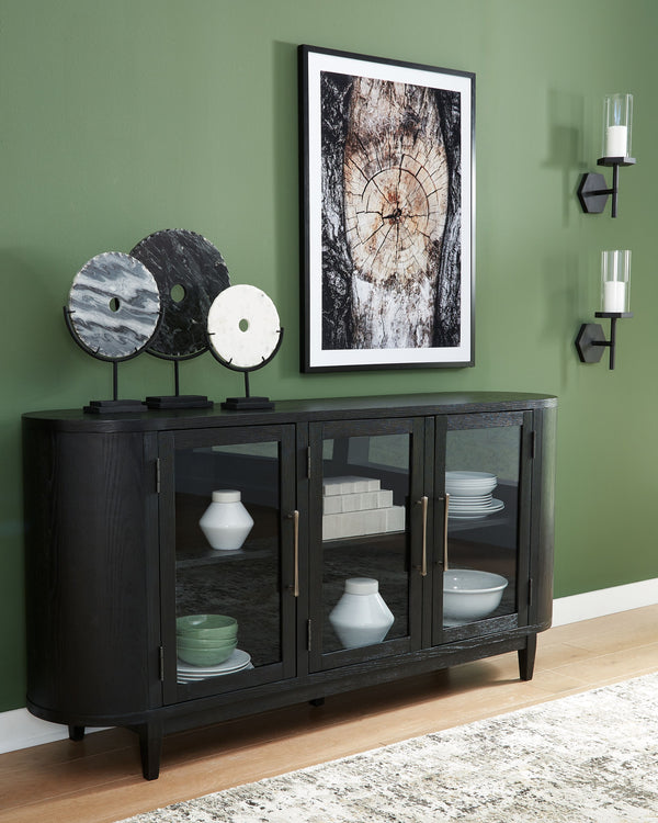  this dining server makes a lasting impression in a simply stunning way. Its magnificent rounded silhouette is enhanced with a rich layered black finish on the textured wood grain surface. Complete with glass cabinet doors