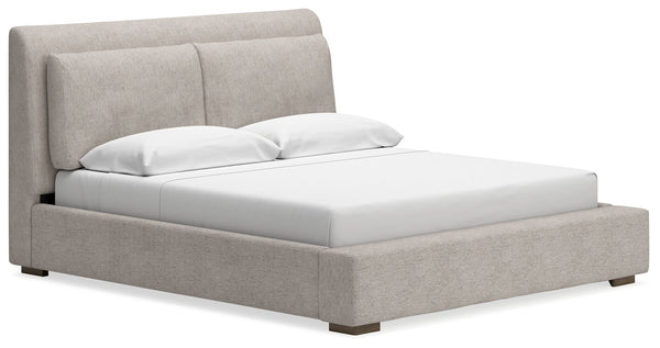 This queen upholstered bed sits comfortably at the intersection of modern lodge and farmhouse aesthetics. Your warm and welcoming disposition is reflected in its subtly tapered headboard and all-over upholstery. Even with its poise, the bed remains practi