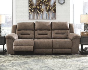  this reclining sofa delivers both with ease. Its high-performance padded faux leather is remarkably durable and easy to clean