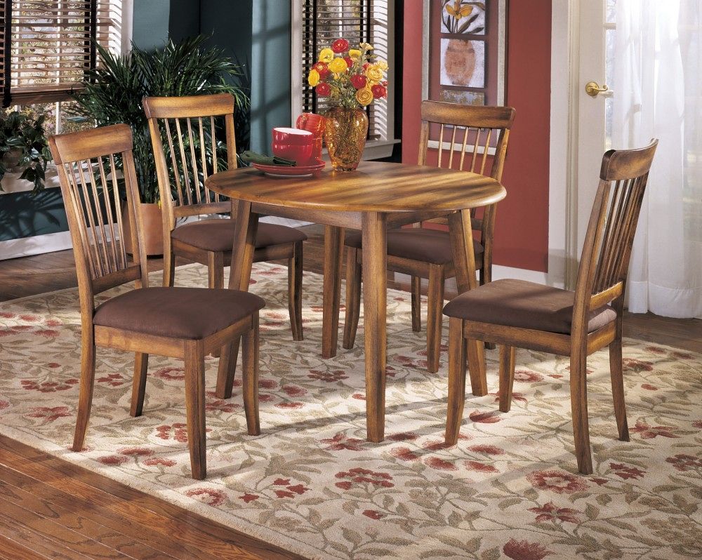 Made with select veneers and hardwood solids. Rustic hand applied finish. Round dining table (-15) features two drop leaves. RTA side chair features microfiber upholstery. Antique finished hardware. <h4><b>Berringer - Rustic Brown - Round DRM Drop Leaf Ta