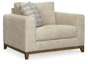 Serene style with a modern sensibility. Delight in the cozy, versatile embrace of this oversized chair. It takes an on-trend approach to irresistible texture and natural beauty, showcasing soft upholstery accented with a transitional wood trim. As refined