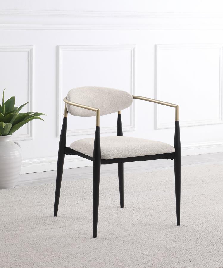 Refresh your dining table with the modern glam flair of a set of two armchairs. Perfect for family and friends, the chair offers impeccable comfort with a padded seat and an oval-shaped backrest with a gentle curvature for excellent support. Its metal fra