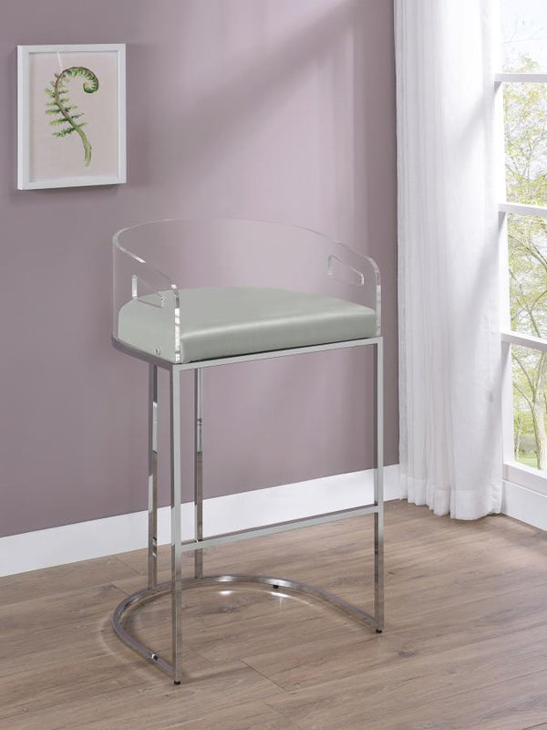  this pair of stools make a striking piece to a dining room space. With a curved backrest in a clear acrylic material