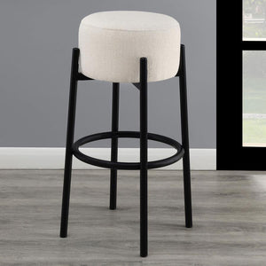  slide this pair of contemporary stools up to a bar or kitchen breakfast area. Designed with a thick pouf-like cushion wrapped in a white upholstery