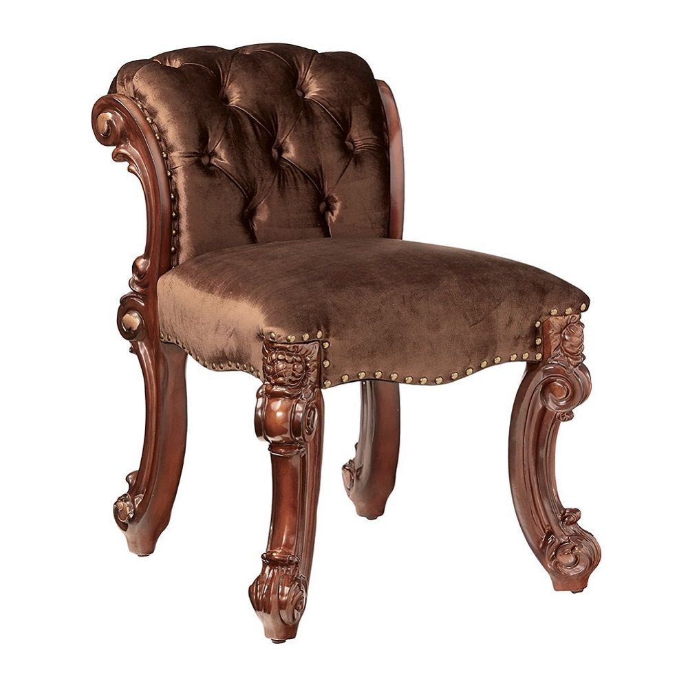 Create an elegant, traditional design in your bedroom with the cherry Vendome vanity stool. This hand-crafted piece inspired from the luxurious designs of the past, this stool features elaborate wood carving details, traditional hardware and a sophisticat