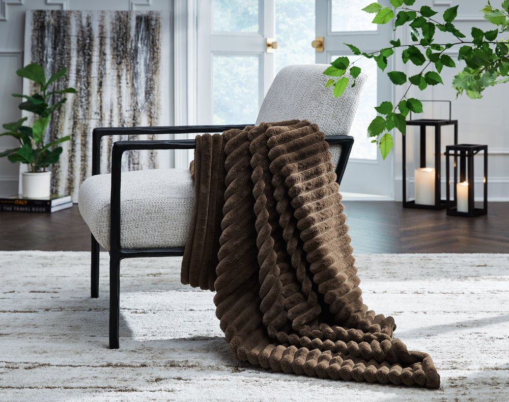 As cozy as they come, this faux fur throw turns your seating area into a haven of comfort. Its neutral hue acts as the perfect foundation for layering, whether mixed with pillows or draped over the arm of a sofa. And itâ€™s machine washable, so you can sp