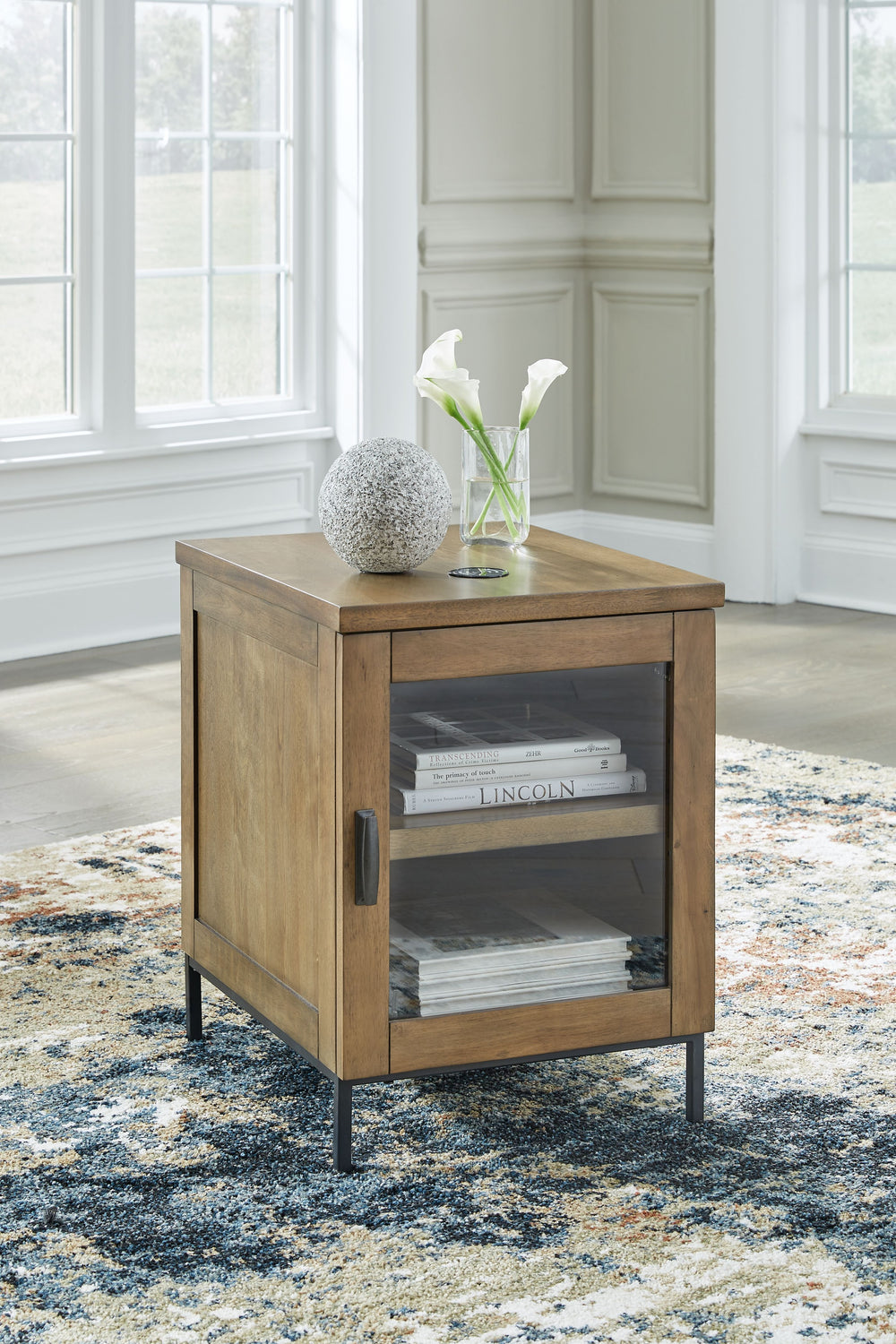 Made for the everyday, this chairside end table is a sleek complement to your casual contemporary living room. Youâ€™ll love the refined-yet-relaxed vibe of its contrasting medium brown finish and matte black legs. Simultaneously store and display decor b