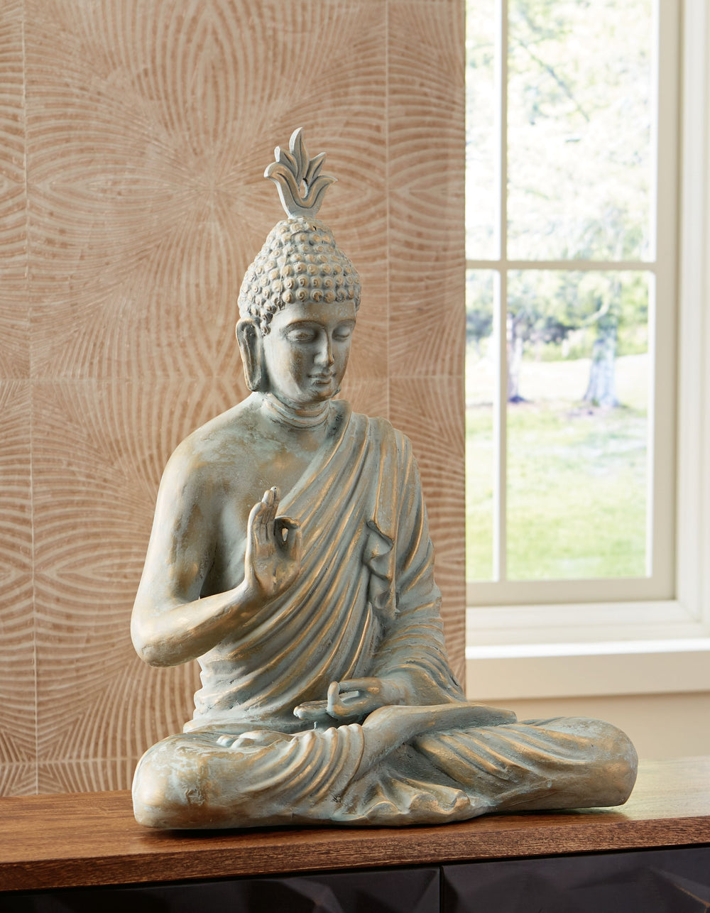 Tune in to Zen and tranquility. This sculpture can be placed in your home or indoor sunroom to create a tranquil space for relaxation and meditation. With its detailed crafting and glorious finish, this piece beautifully captures fluidity and mystique.<br