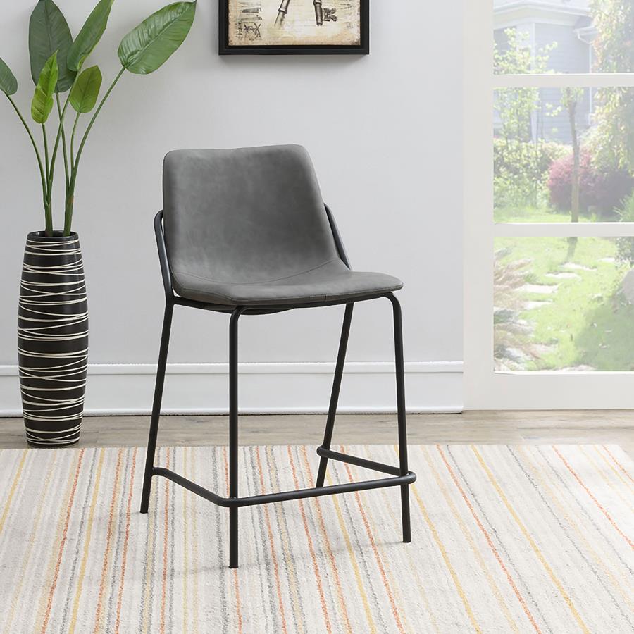 This pair of two stools offer a minimal look and a contemporary vibe. Supported by thin and tall frame in a black finish, it has an open and airy design that works with many styles. Each chair has a bucket style, Mid Century inspired seat, which is wrappe