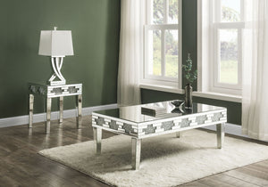 Undeniably magnificence with glam flair, this Noralie Coffee Table is meant to become your favorite focus in your living room. Mirrored accents with faux stones inlay achieve a modern glamour look. This piece makes a glam style statement that offers a sat