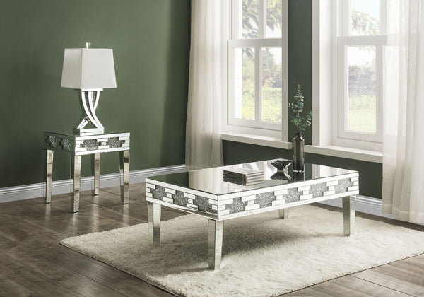 Undeniably magnificence with glam flair, this Noralie Coffee Table is meant to become your favorite focus in your living room. Mirrored accents with faux stones inlay achieve a modern glamour look. This piece makes a glam style statement that offers a sat