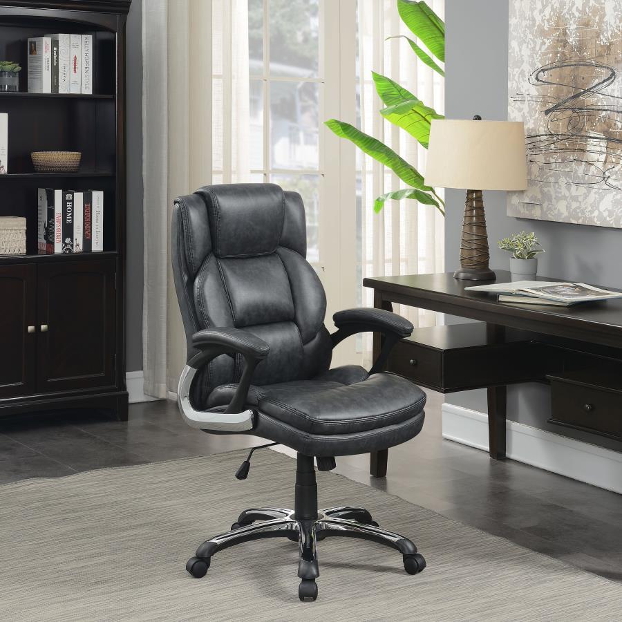 Perfect for a home office, this office chair features plush seating and headrest for working long hours. Wrapped in a supple leatherette, this chair also offers ergonomic design with curved, padded armrests. Get around the office easily with five chrome c
