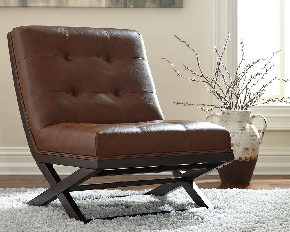 Inspired by the quintessential Barcelona chair, this contemporary accent chair with scissor base is high design on a comfortable budget. Fabulous faux leather is enhanced with button tufting. Armless design is an especially smart choice for small spaces.<