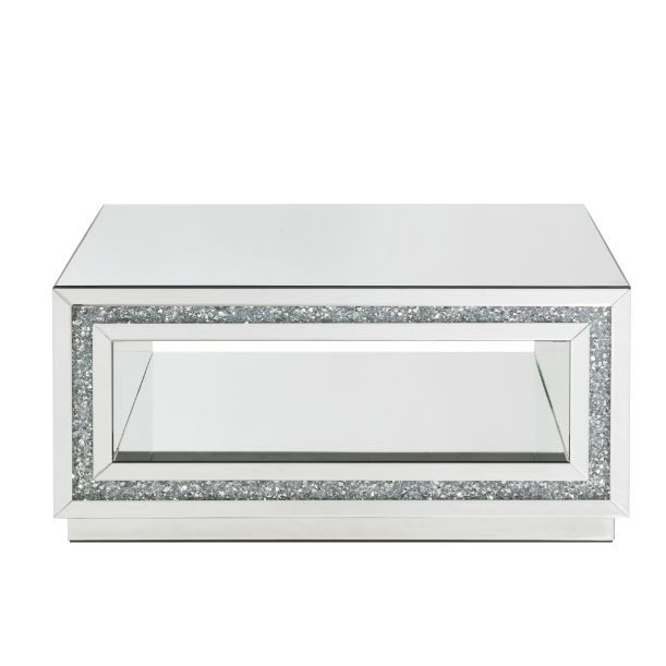 Make a striking statement in your home with this Noralie Coffee Table. Featuring mirror finish with faux diamond inlay, it creates a bold, yet elegant textured look. Shimmering border design with faux diamonds adds modern glamour to this piece. The bottom