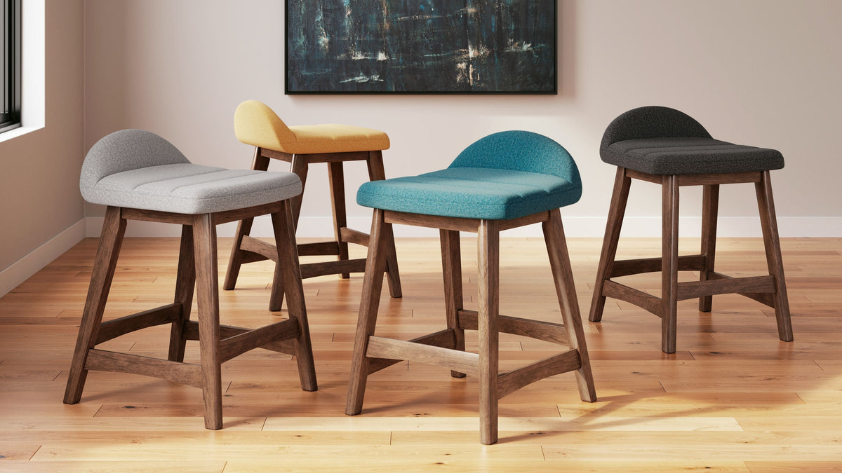  capturing the architectural language of mid-century stylings. The seat invites the eye with a soft-edged silhouette and chic blue cush