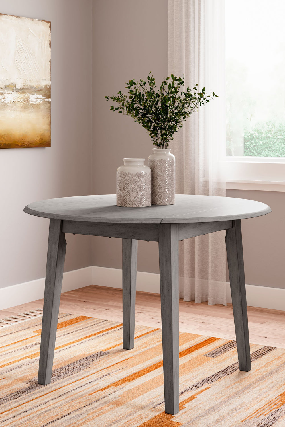 Serve up casual elegance with this dining room set. Its approachable character ushers a relaxed feel into kitchen nooks and small dining rooms. Two drop leaves provide just enough table space to accommodate the drop-in guest and the chair design details l