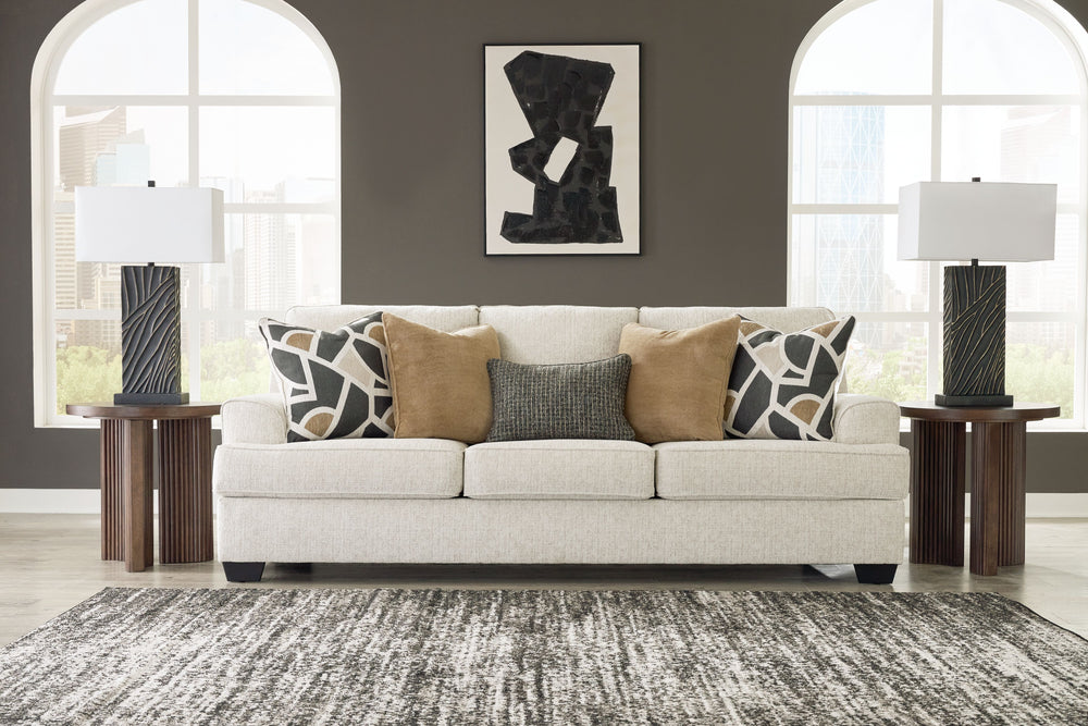 Embrace effortless elegance with this sofa and loveseat set. Its clean lines and curved details are right at home in contemporary settings. Stressed about styling? The neutral hue easily pairs with your existing color palette. From lounging alone to socia